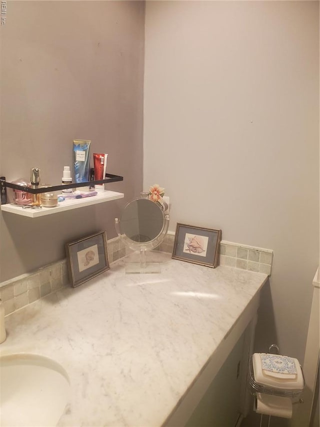 bathroom with toilet and vanity