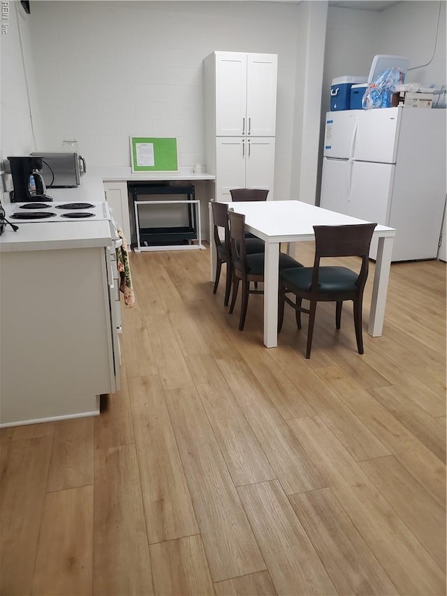 dining room featuring light wood finished floors