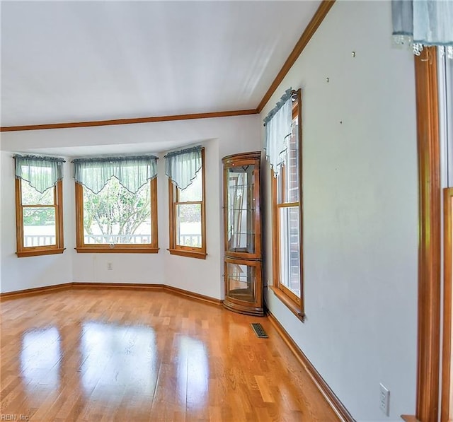 617 Saint Brides Rd W, Chesapeake, VA 23322 - unfurnished room featuring visible vents, crown molding, baseboards, and light wood-style floors