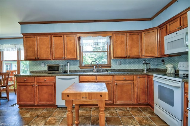 617 Saint Brides Rd W, Chesapeake, VA 23322 - kitchen with white appliances, brown cabinets, and a sink