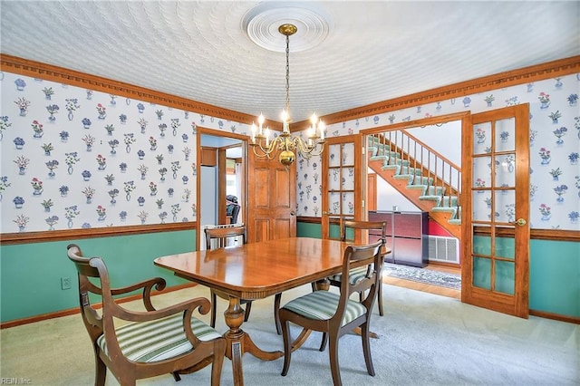 617 Saint Brides Rd W, Chesapeake, VA 23322 - dining room featuring wallpapered walls, a notable chandelier, and stairway