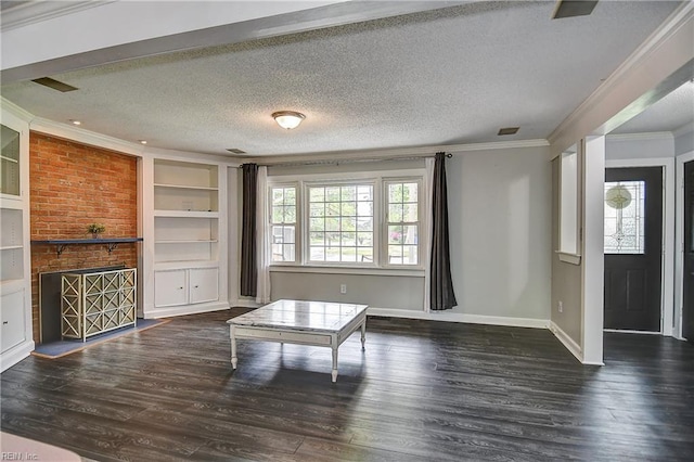 unfurnished living room featuring crown molding, wood finished floors, a textured ceiling, and plenty of natural light