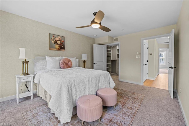 bedroom with a ceiling fan, visible vents, carpet, and baseboards
