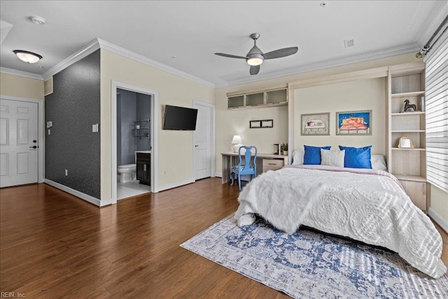 bedroom featuring baseboards, wood finished floors, and crown molding