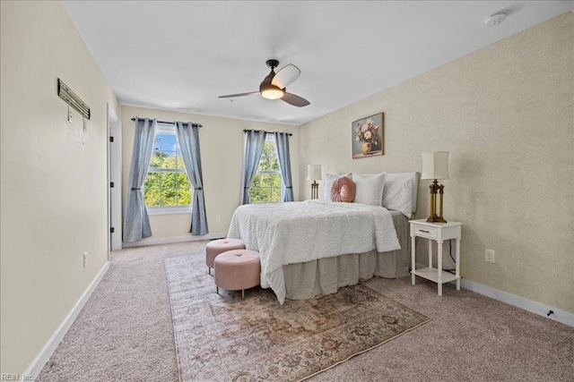 bedroom with baseboards, a ceiling fan, and carpet