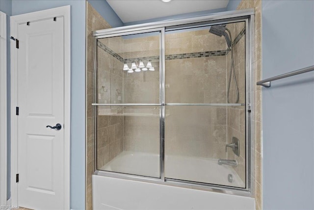 full bathroom featuring combined bath / shower with glass door