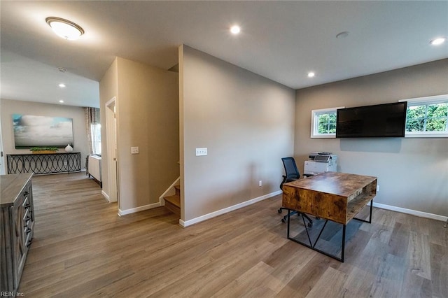 office with baseboards, recessed lighting, and light wood-style floors