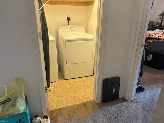 2310 S St S, Franklin, VA 23851 - laundry room featuring light floors, light carpet, laundry area, and washing machine and dryer