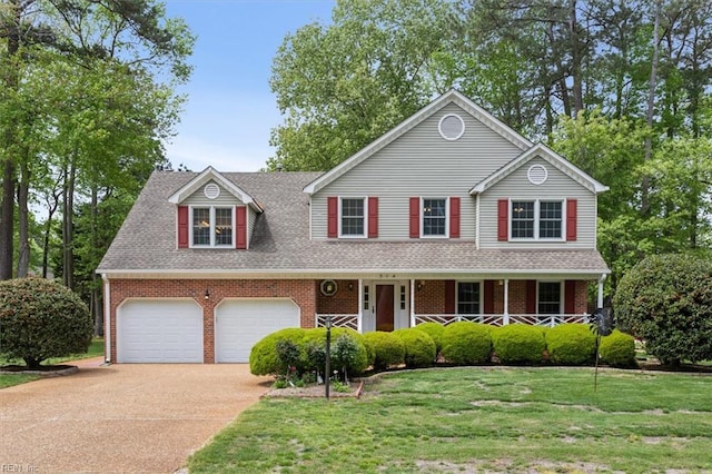 traditional-style house featuring brick siding, a front lawn, driveway, and a shingled roof