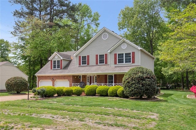 traditional home featuring a front lawn, brick siding, a porch, and dirt driveway