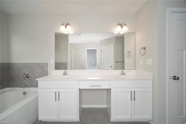 full bathroom featuring a bath, double vanity, tile patterned flooring, and a sink