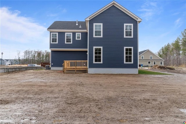 rear view of property with a wooden deck