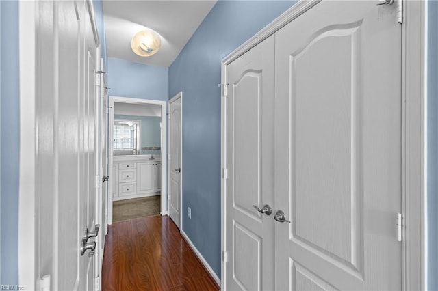 hallway with dark wood-style floors