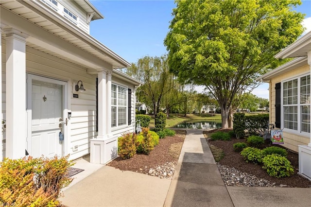 property entrance with a water view