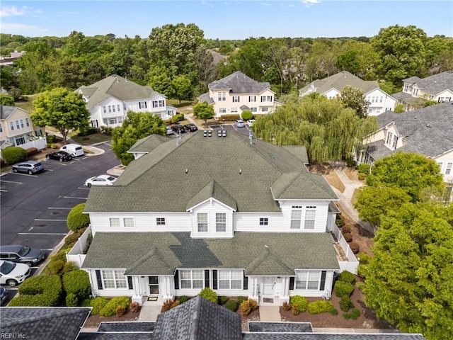 birds eye view of property with a residential view