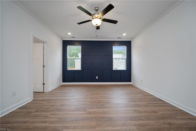 unfurnished room featuring baseboards, recessed lighting, wood finished floors, ceiling fan, and ornamental molding