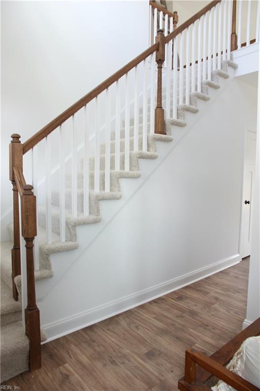 2229 Captiva Ln, Chesapeake, VA 23321 - stairs with wood finished floors and baseboards