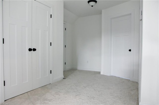 2229 Captiva Ln, Chesapeake, VA 23321 - unfurnished bedroom with lofted ceiling, light carpet, and baseboards