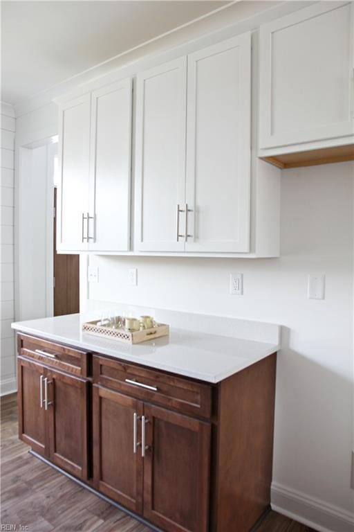 2229 Captiva Ln, Chesapeake, VA 23321 - kitchen featuring light countertops, wood finished floors, and white cabinetry