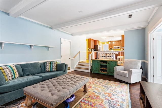 living area featuring beamed ceiling, visible vents, stairs, and dark wood-style flooring