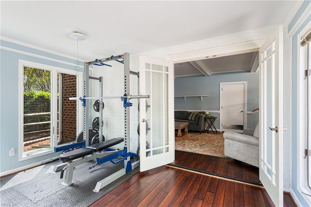 workout area with baseboards, ornamental molding, french doors, and hardwood / wood-style floors