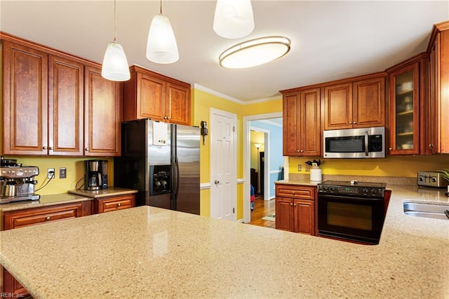 kitchen with range with electric stovetop, fridge with ice dispenser, a sink, stainless steel microwave, and light stone countertops