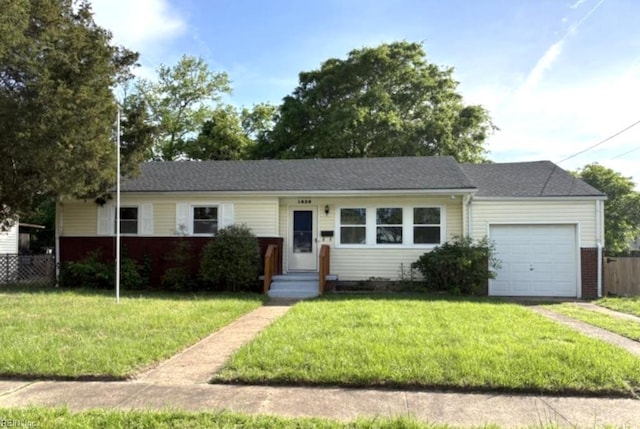 1839 Brookwood Rd, Norfolk, VA 23518 - view of front of property with a front lawn, driveway, fence, and a garage