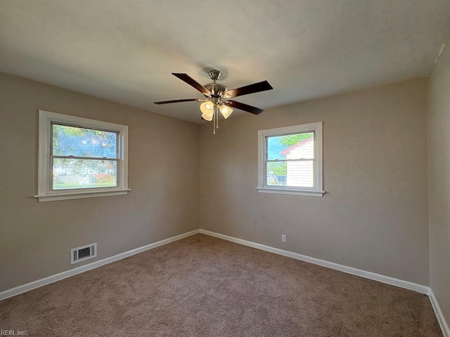1839 Brookwood Rd, Norfolk, VA 23518 - carpeted empty room with visible vents, a ceiling fan, and baseboards