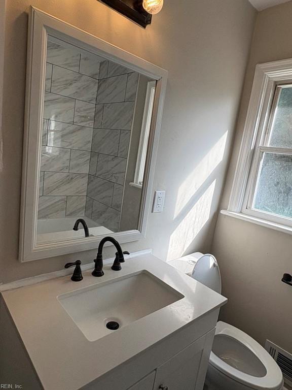 1839 Brookwood Rd, Norfolk, VA 23518 - bathroom with visible vents, toilet, and vanity