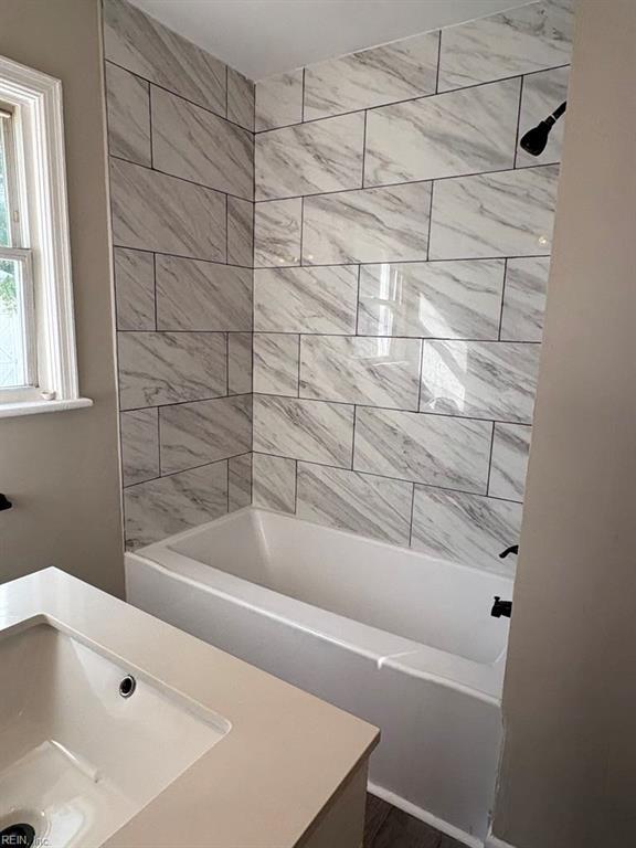 1839 Brookwood Rd, Norfolk, VA 23518 - bathroom featuring washtub / shower combination and a sink