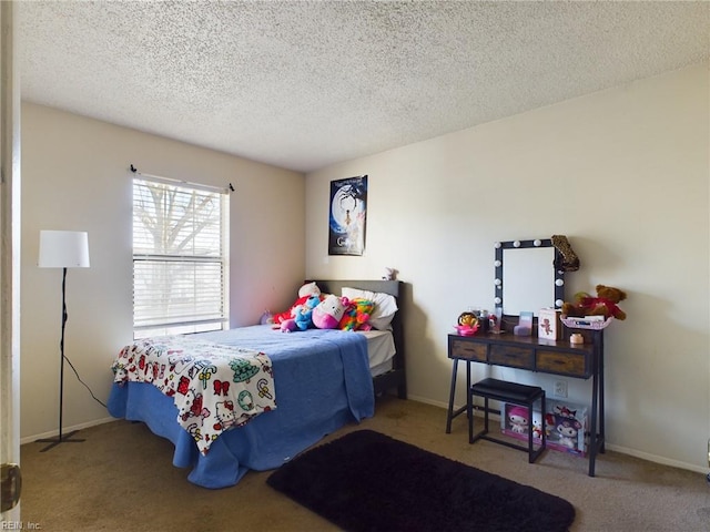 carpeted bedroom featuring baseboards and a textured ceiling