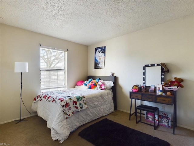 carpeted bedroom with baseboards and a textured ceiling