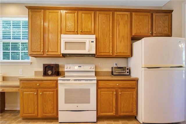 3733 Captain Wynne Dr, Williamsburg, VA 23185 - kitchen with light countertops, a toaster, brown cabinets, and white appliances