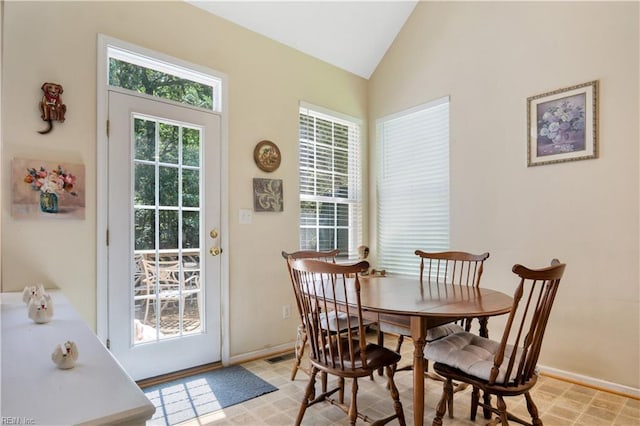 3733 Captain Wynne Dr, Williamsburg, VA 23185 - dining area with baseboards, vaulted ceiling, and visible vents
