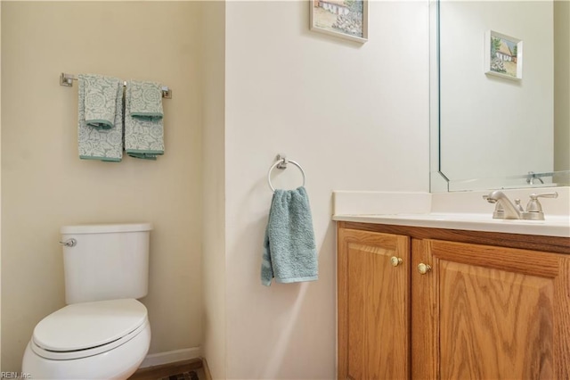 3733 Captain Wynne Dr, Williamsburg, VA 23185 - bathroom featuring toilet, baseboards, and vanity