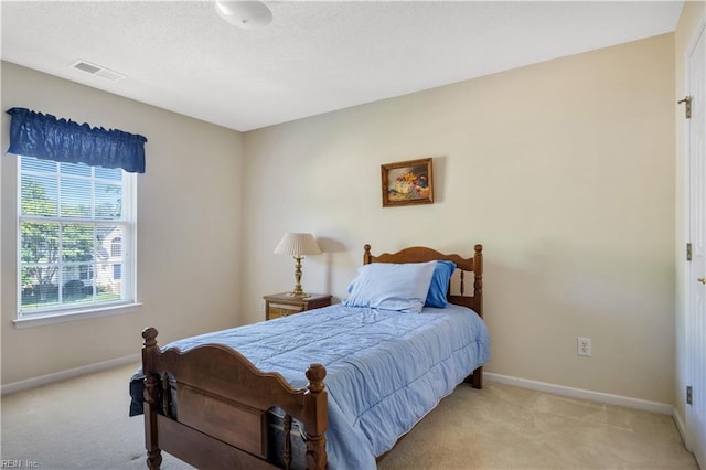3733 Captain Wynne Dr, Williamsburg, VA 23185 - bedroom with light colored carpet, baseboards, and visible vents