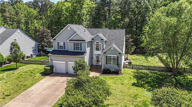 3733 Captain Wynne Dr, Williamsburg, VA 23185 - traditional-style house featuring fence, an attached garage, a shingled roof, a front yard, and concrete driveway