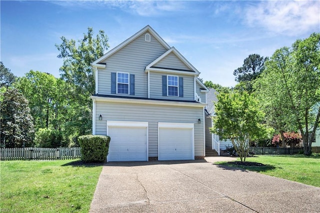 3733 Captain Wynne Dr, Williamsburg, VA 23185 - view of front of property featuring an attached garage, fence, a front yard, and concrete driveway
