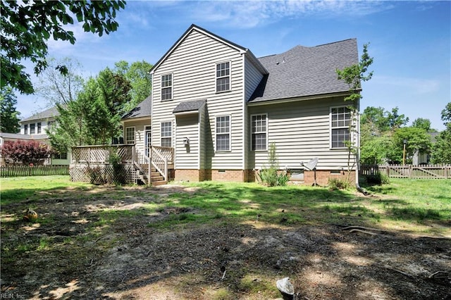 3733 Captain Wynne Dr, Williamsburg, VA 23185 - back of property with a fenced backyard, roof with shingles, a deck, and crawl space