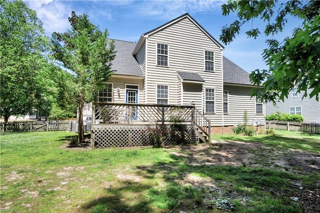3733 Captain Wynne Dr, Williamsburg, VA 23185 - rear view of house with a lawn, a shingled roof, and a fenced backyard