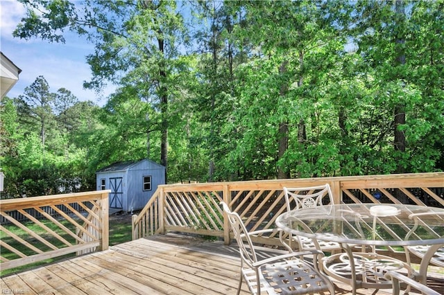 3733 Captain Wynne Dr, Williamsburg, VA 23185 - wooden deck featuring an outdoor structure and a storage unit
