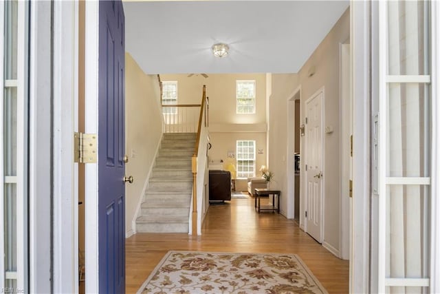 3733 Captain Wynne Dr, Williamsburg, VA 23185 - foyer with baseboards, light wood finished floors, and stairway