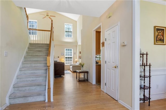 3733 Captain Wynne Dr, Williamsburg, VA 23185 - stairway with ceiling fan, wood finished floors, and high vaulted ceiling