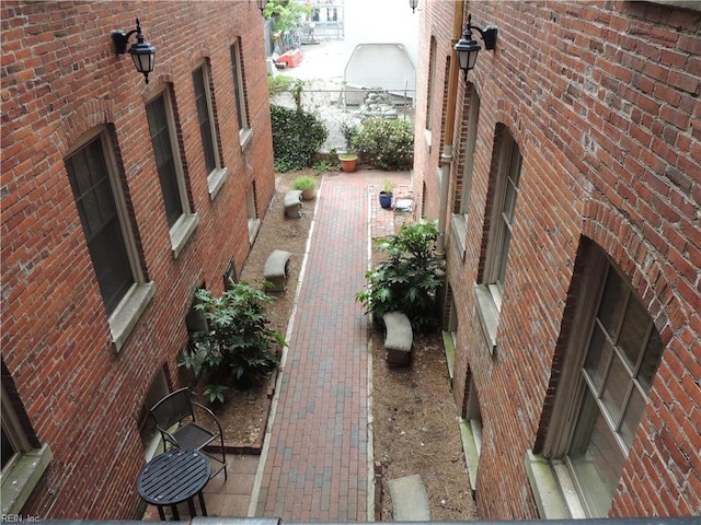 view of property exterior featuring brick siding