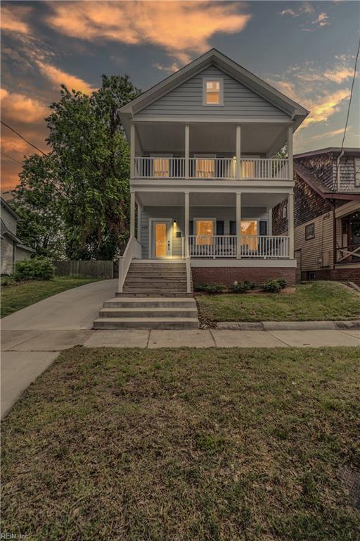 429 Maryland Ave, Norfolk, VA 23508 - view of front of home with a porch, a balcony, and a front lawn