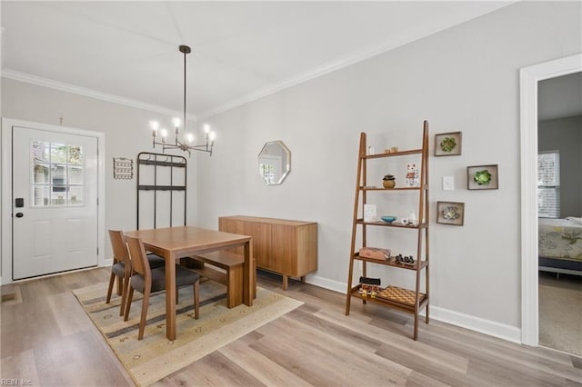 429 Maryland Ave, Norfolk, VA 23508 - dining room with a healthy amount of sunlight, light wood-type flooring, crown molding, and a notable chandelier
