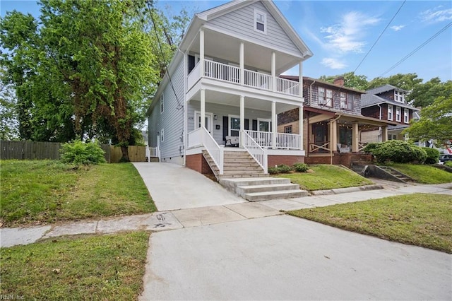 429 Maryland Ave, Norfolk, VA 23508 - neoclassical / greek revival house with a front lawn, fence, covered porch, and a balcony