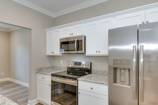 kitchen featuring white cabinets, stainless steel appliances, light wood-type flooring, crown molding, and light stone countertops