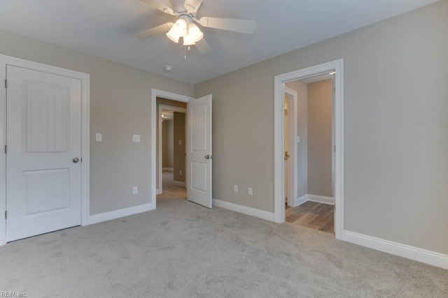 unfurnished bedroom with carpet floors, baseboards, and ceiling fan