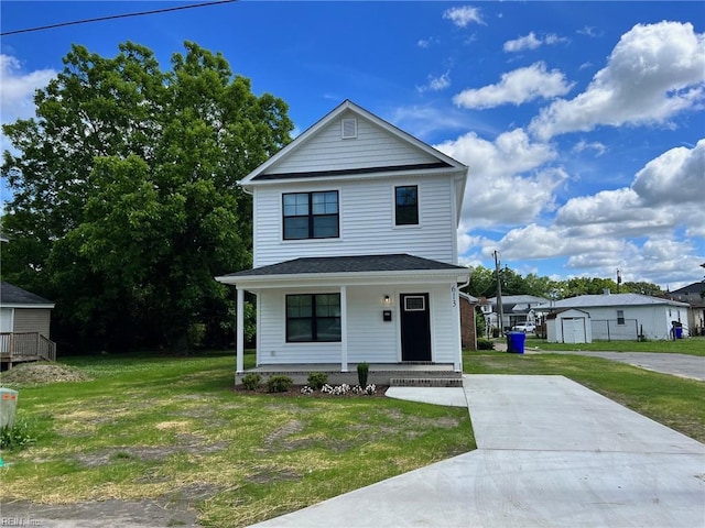 view of front of property with a porch and a front lawn